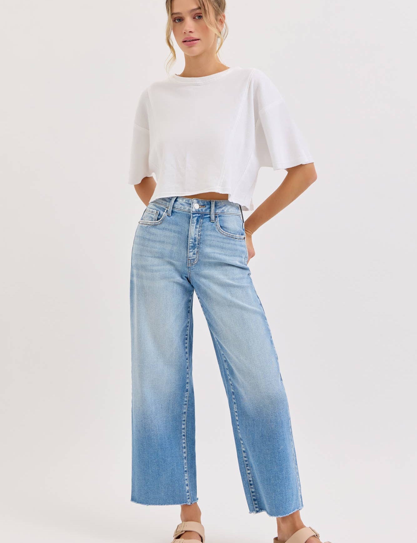 high rise wide leg jeans, light wash wide leg jeans, cropped wide leg denim, raw hem jeans, women's high rise jeans, light wash denim pants, stretchy wide leg jeans, everyday denim, cropped jeans women, casual blue jeans