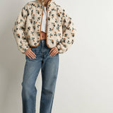 ivory floral sherpa jacket with rust and green print, contrast brown piping, snap front, stand collar, and relaxed fit