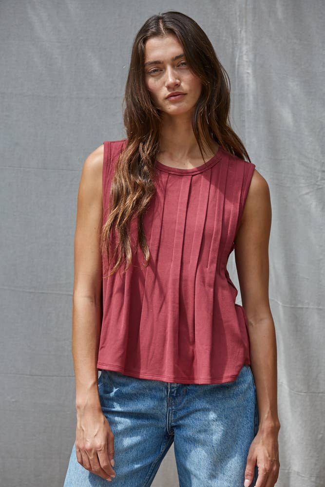 rust red sleeveless rayon blend tank top with front pleats, crew neckline and relaxed gathered silhouette