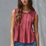 rust red sleeveless rayon blend tank top with front pleats, crew neckline and relaxed gathered silhouette