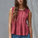 rust red sleeveless rayon blend tank top with front pleats, crew neckline and relaxed gathered silhouette