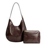 a chocolate brown croc-embossed shoulder bag with an adjustable strap, gold-tone hardware and removable organizer pouch.