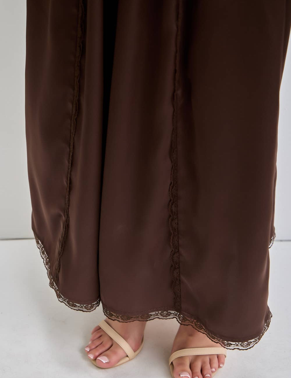 chocolate satin wide leg pants with an elastic waist, pockets and delicate lace detailing. wear them alone or pair with the matching top, sold separately.