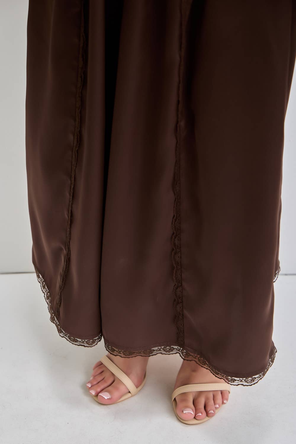 chocolate satin wide leg pants with an elastic waist, pockets and delicate lace detailing. wear them alone or pair with the matching top, sold separately.