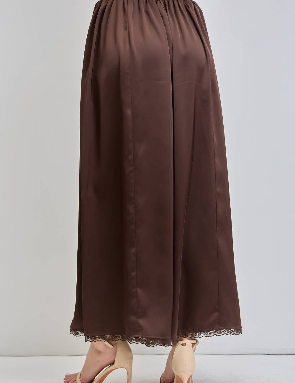 chocolate satin wide leg pants with an elastic waist, pockets and delicate lace detailing. wear them alone or pair with the matching top, sold separately.
