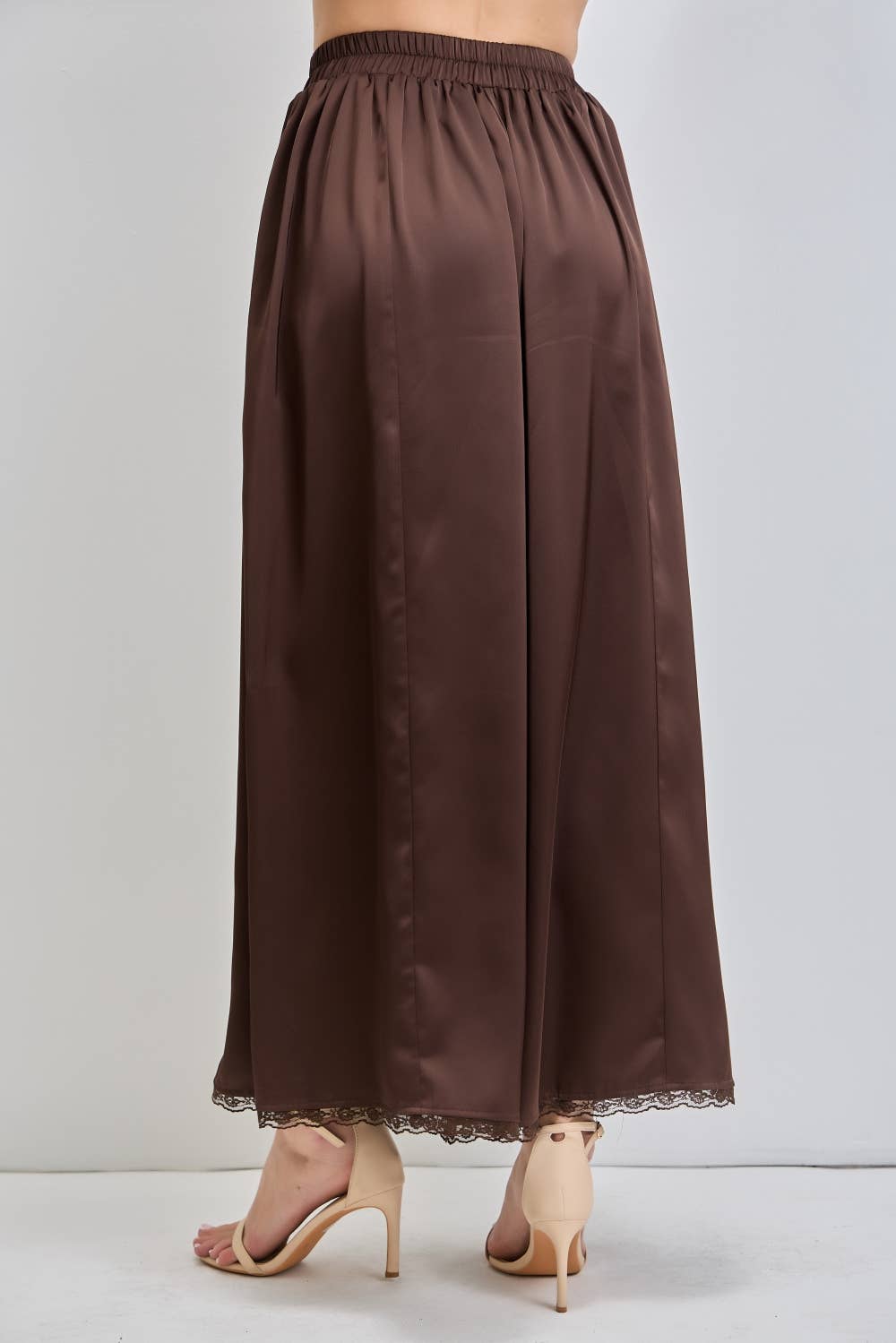 chocolate satin wide leg pants with an elastic waist, pockets and delicate lace detailing. wear them alone or pair with the matching top, sold separately.