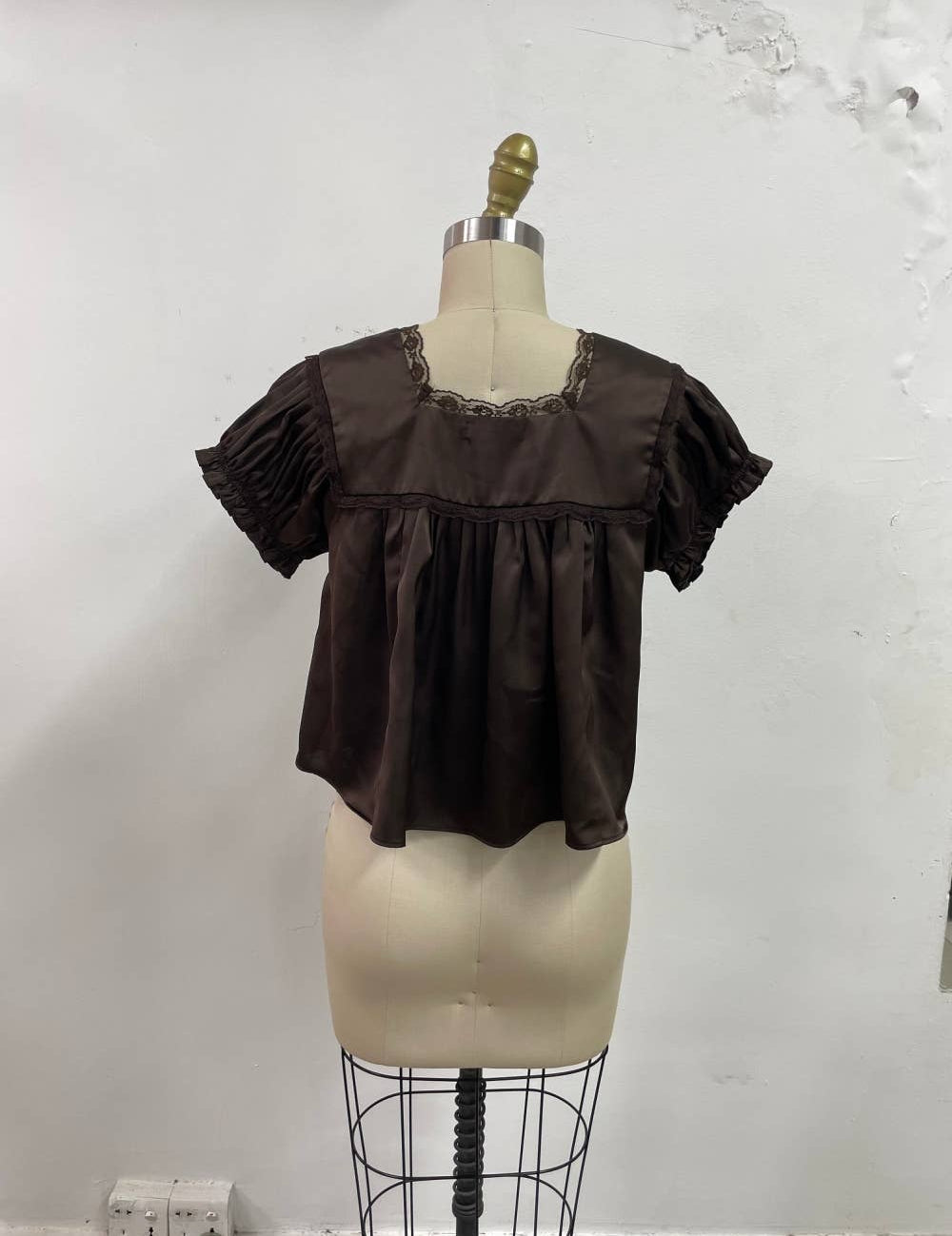 chocolate brown satin v-neck top with lace trim, empire waist and short flutter sleeves