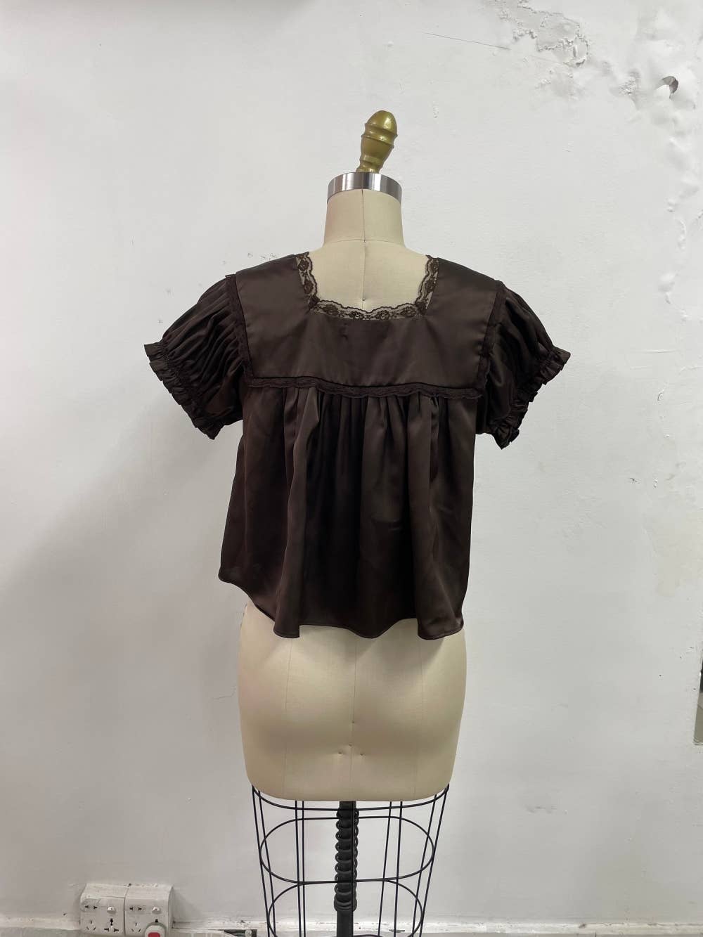 chocolate brown satin v-neck top with lace trim, empire waist and short flutter sleeves