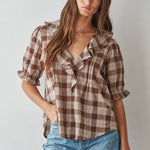 women's brown plaid top, brown plaid blouse, brown and cream plaid top, plaid ruffle blouse, ruffle v neck top, women's plaid fall top, western plaid top, cowgirl plaid shirt, puff sleeve plaid blouse, women's western top, brown fall blouse, country concert outfit women, western fall outfit women, plaid matching set women, matching top and skirt set, brown plaid matching set, fall matching set women, western matching set, plaid top with jeans, fall top with cowboy boots, women's boutique fall clothing