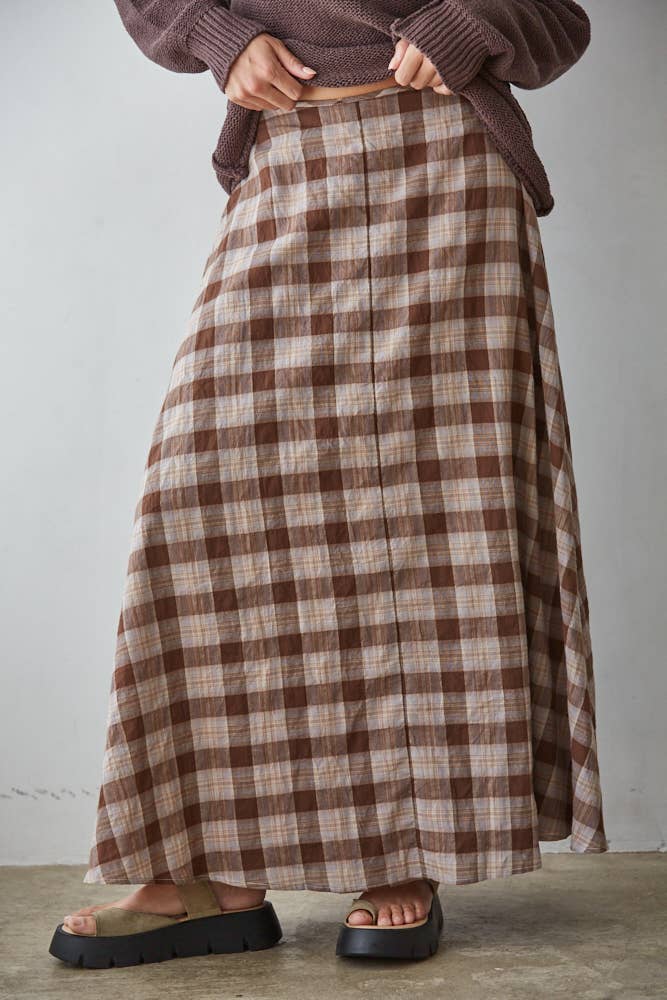 a brown and cream plaid midi skirt with a full flared silhouette and elastic back waistband. wear it alone or pair with the matching Antelope Top.
