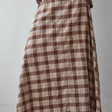 a brown and cream plaid midi skirt with a full flared silhouette and elastic back waistband. wear it alone or pair with the matching Antelope Top.