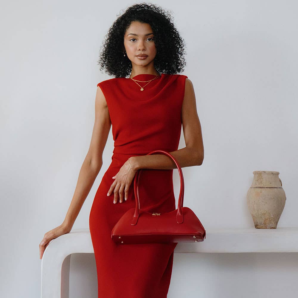 small red shoulder bag shown on model
