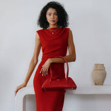 small red shoulder bag shown on model