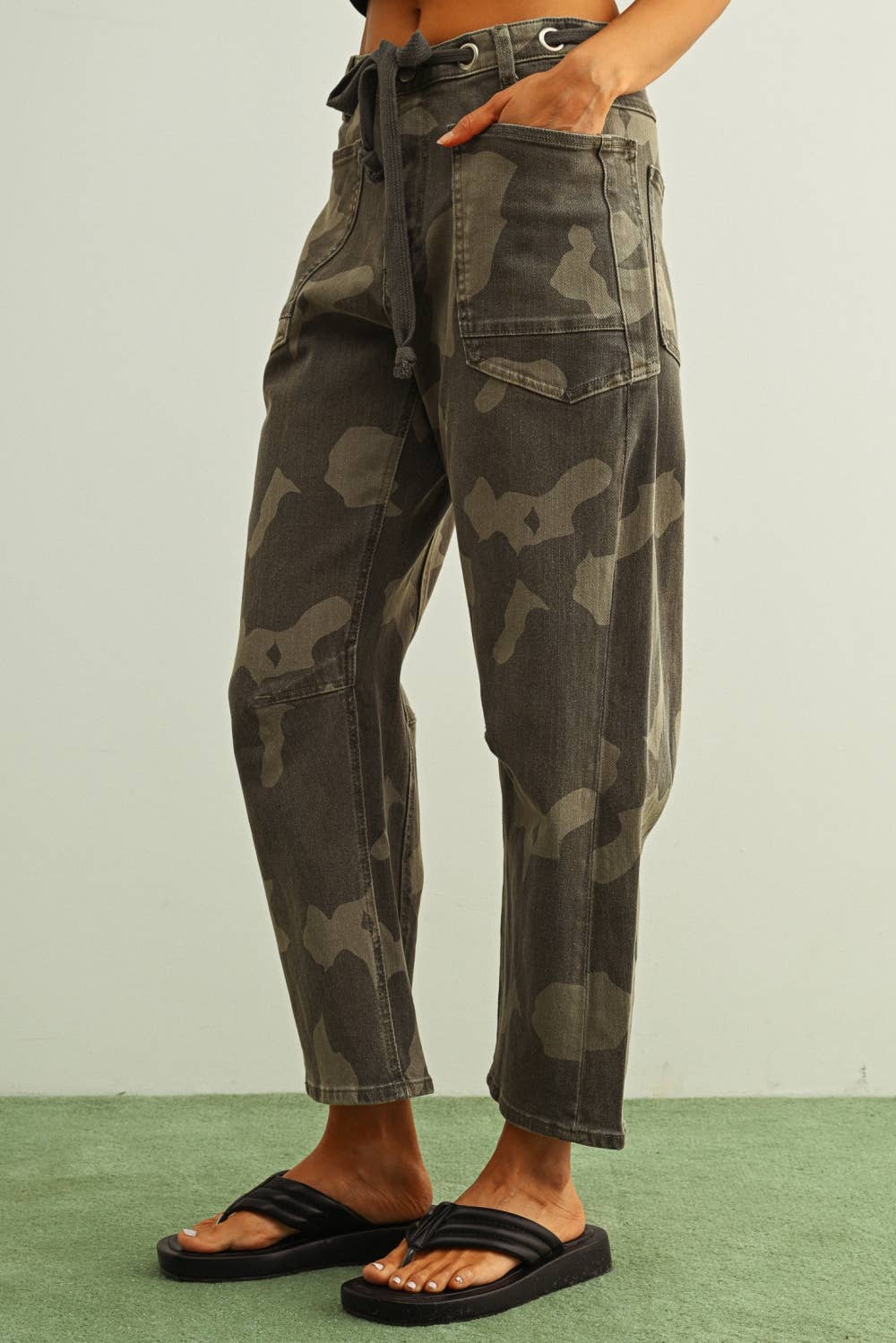 camouflage straight leg utility pants with drawstring waist
washed camo cotton twill pants with patch pockets
relaxed fit camouflage pants for women
cropped straight leg camo utility pants
cotton stretch cargo-inspired pants with adjustable waist
olive camouflage casual pants with front patch pockets
relaxed camouflage trousers styled with black tank
utility-inspired camo pants with drawstring belt
