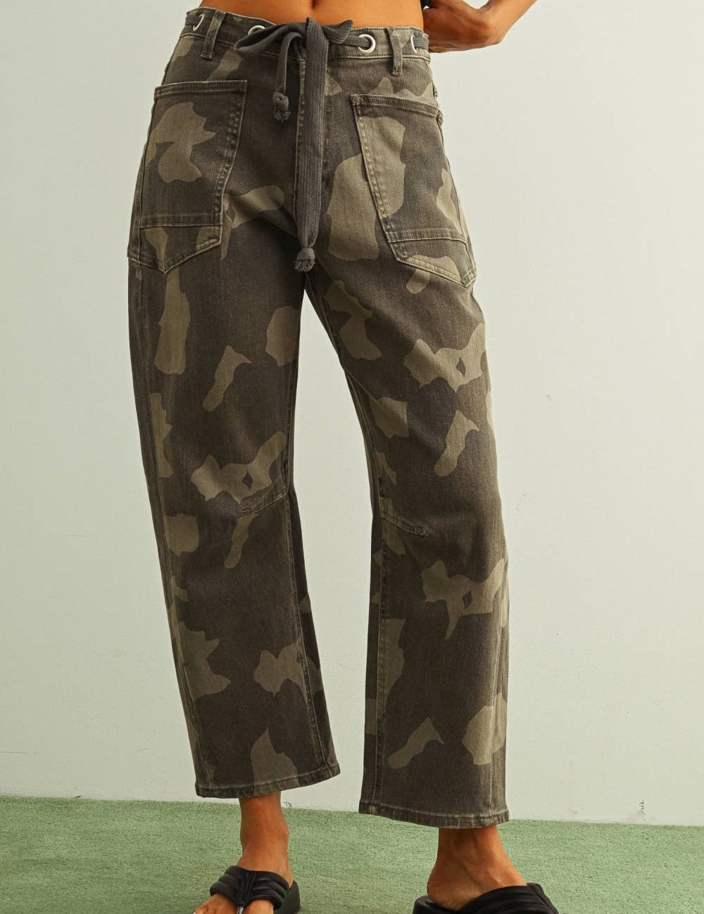 camouflage straight leg utility pants with drawstring waist
washed camo cotton twill pants with patch pockets
relaxed fit camouflage pants for women
cropped straight leg camo utility pants
cotton stretch cargo-inspired pants with adjustable waist
olive camouflage casual pants with front patch pockets
relaxed camouflage trousers styled with black tank
utility-inspired camo pants with drawstring belt