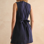 navy linen dress
button front linen dress
sleeveless mini dress
navy summer dress
linen shift dress
navy casual dress
linen dress with pockets
button front mini dress
fully lined linen dress
adjustable back tie dress
classic summer dress
navy sleeveless dress
boutique linen clothing
vacation dress women
timeless summer style
casual linen dress
women's linen mini dress
easy summer outfit
linen dress with buttons
americana summer fashion