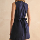 navy linen dress
button front linen dress
sleeveless mini dress
navy summer dress
linen shift dress
navy casual dress
linen dress with pockets
button front mini dress
fully lined linen dress
adjustable back tie dress
classic summer dress
navy sleeveless dress
boutique linen clothing
vacation dress women
timeless summer style
casual linen dress
women's linen mini dress
easy summer outfit
linen dress with buttons
americana summer fashion