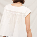 white embroidered blouse
embroidered summer top
white peasant blouse
lightweight rayon blouse
feminine summer top
casual white boutique top
embroidered detail shirt
relaxed fit white blouse
summer farmers market outfit
southern summer style
easy vacation outfit
white top with embroidery
flowy summer blouse
countryside summer fashion
casual feminine clothing
breathable warm weather top
white short sleeve blouse
classic summer wardrobe staple
boutique women's clothing
effortless everyday style