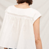 white embroidered blouse
embroidered summer top
white peasant blouse
lightweight rayon blouse
feminine summer top
casual white boutique top
embroidered detail shirt
relaxed fit white blouse
summer farmers market outfit
southern summer style
easy vacation outfit
white top with embroidery
flowy summer blouse
countryside summer fashion
casual feminine clothing
breathable warm weather top
white short sleeve blouse
classic summer wardrobe staple
boutique women's clothing
effortless everyday style