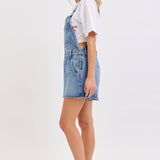 medium wash denim shortalls with square neckline
women's denim overalls shorts with side buttons
relaxed fit cotton denim shortalls
classic blue jean shortalls for women
summer denim overalls styled with white tank top
medium wash denim romper overalls with pockets
casual cotton shortalls for summer
vintage inspired denim shortalls with adjustable straps