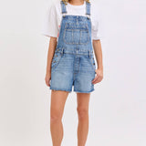 medium wash denim shortalls with square neckline
women's denim overalls shorts with side buttons
relaxed fit cotton denim shortalls
classic blue jean shortalls for women
summer denim overalls styled with white tank top
medium wash denim romper overalls with pockets
casual cotton shortalls for summer
vintage inspired denim shortalls with adjustable straps