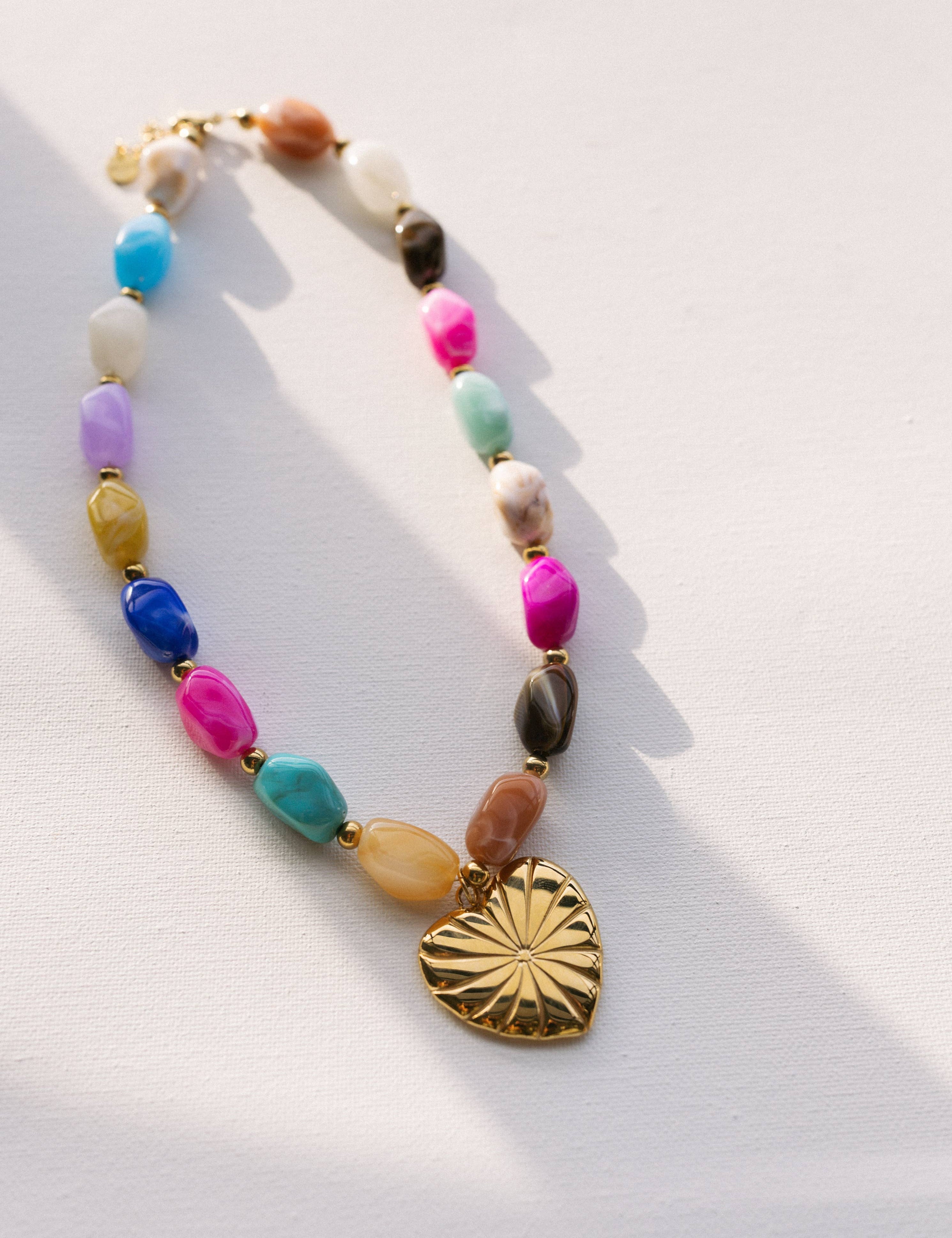 heart pendant necklace
beaded heart necklace
chunky statement necklace
colorful beaded necklace
waterproof necklace
tarnish resistant necklace
gold heart necklace
statement charm necklace
layering necklace
hypoallergenic necklace
pool safe jewelry
beach safe jewelry
gift for moms necklace
west of may jewelry
béljoy necklace