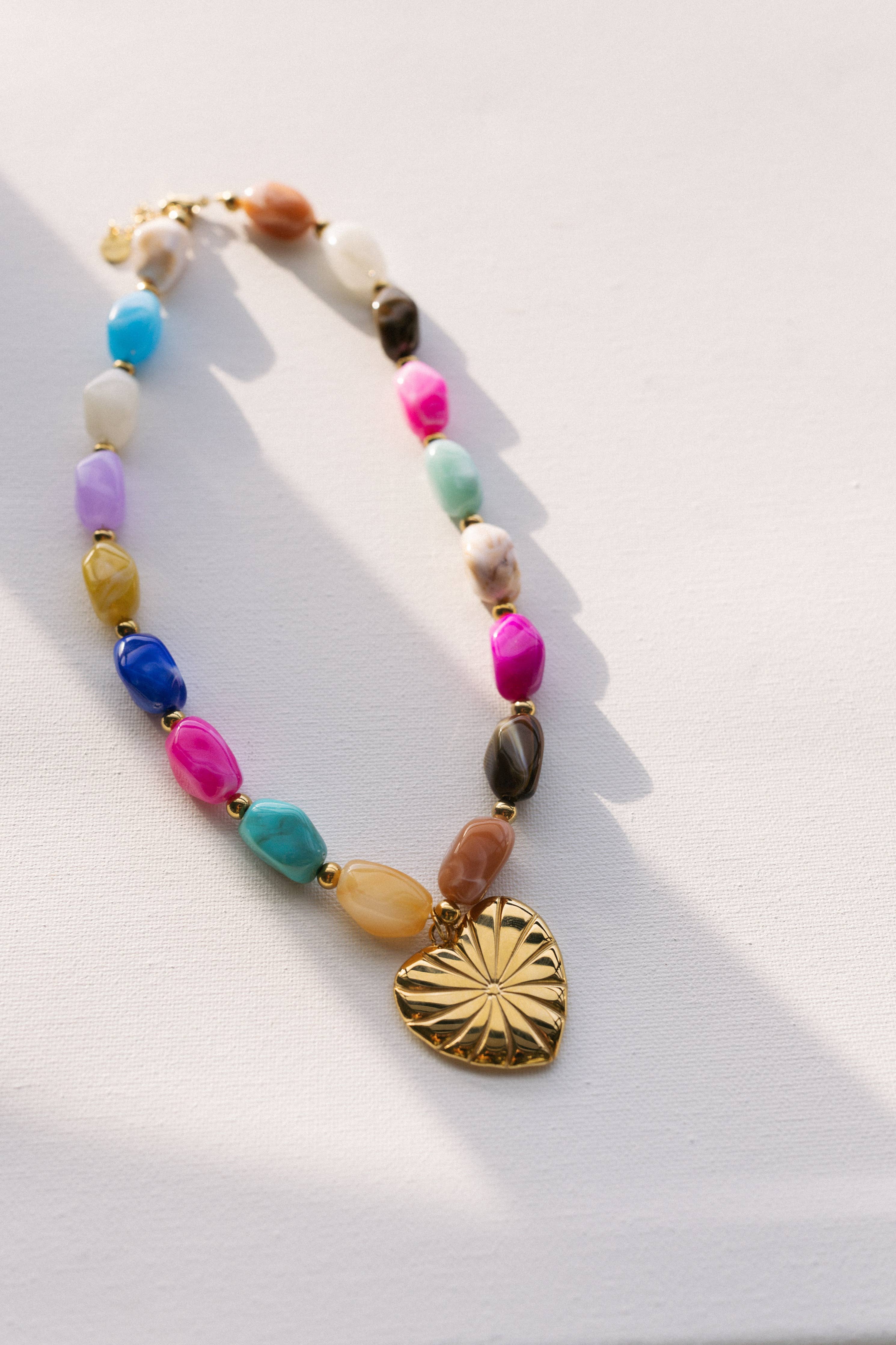 heart pendant necklace
beaded heart necklace
chunky statement necklace
colorful beaded necklace
waterproof necklace
tarnish resistant necklace
gold heart necklace
statement charm necklace
layering necklace
hypoallergenic necklace
pool safe jewelry
beach safe jewelry
gift for moms necklace
west of may jewelry
béljoy necklace
