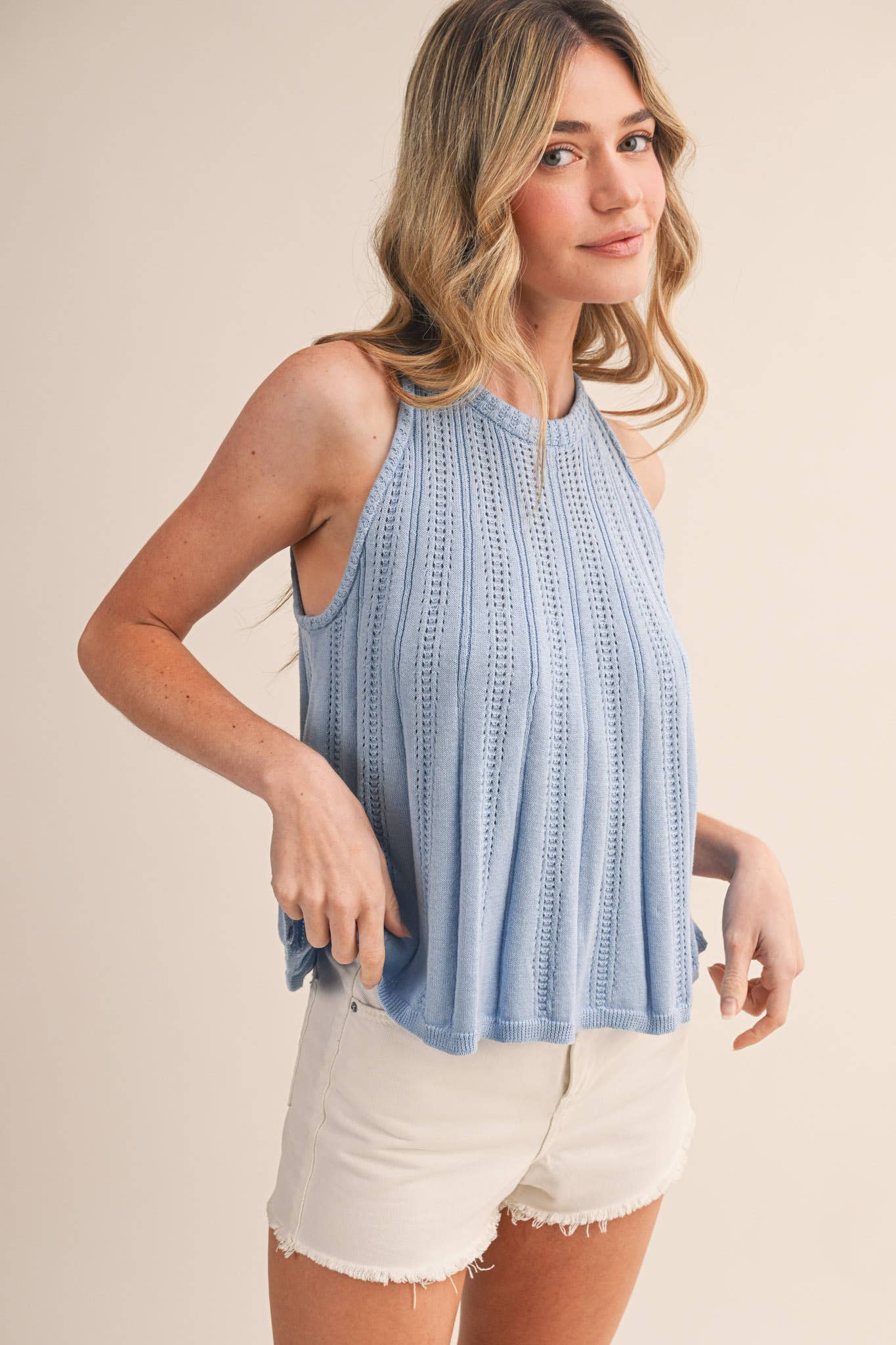 blue pointelle sweater tank
sleeveless knit tank women
lightweight sweater knit tank
round neck summer knit top
soft blue sleeveless sweater top
pointelle knit summer tank
women’s swing knit tank
coastal summer knit top
elevated casual summer top
summer spritz collection top