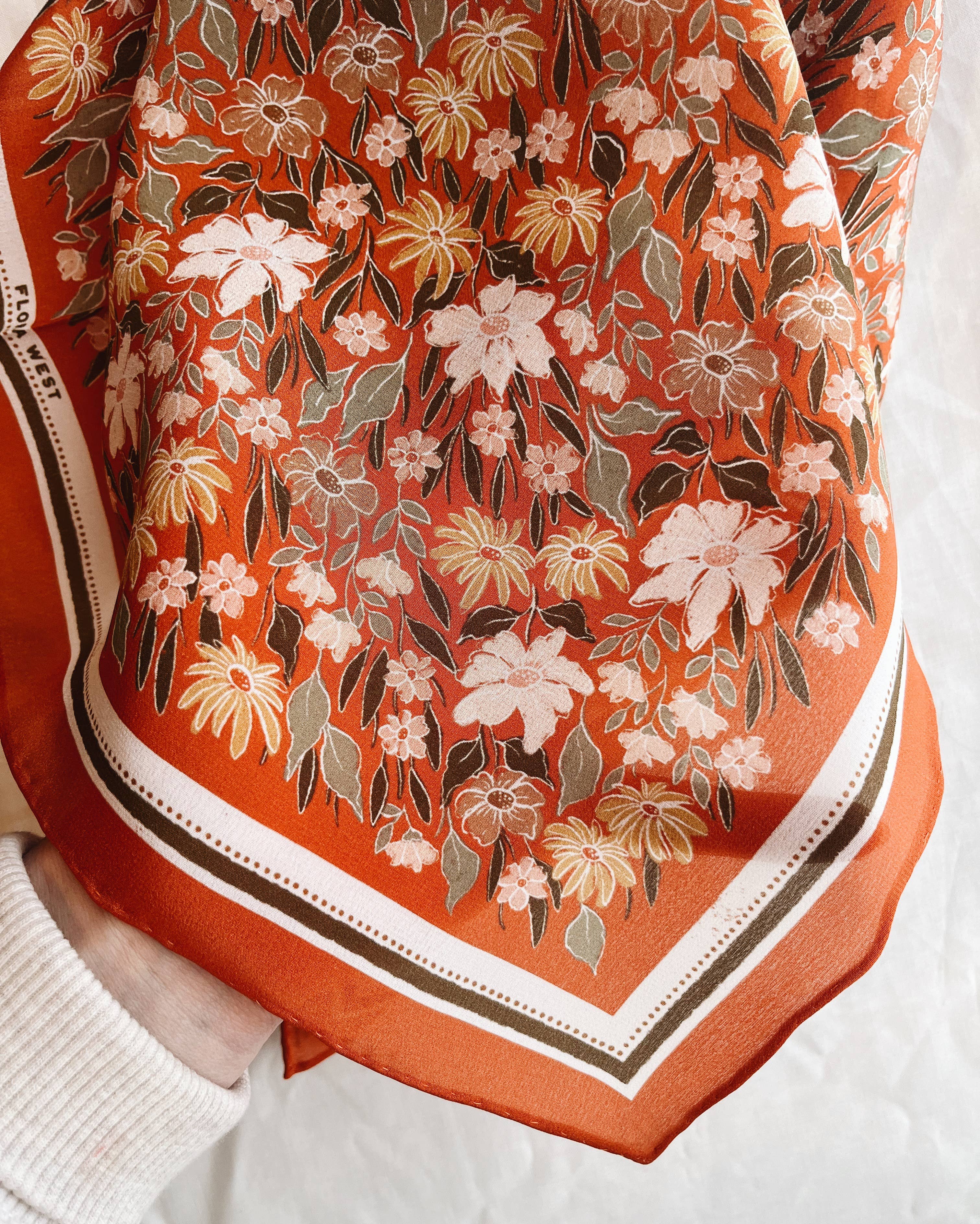 silk bandana, silk headscarf, silk scarf, silk hair scarf, hair scarf, western hair scarf, hair accessory, boho aesthetic, western aesthetic, outfit of the day, johnson city boutique, outfit idea, accessories, womens clothing, cool girl aesthetic, clean girl aesthetic, orange silk bandana, botanical silk scarf, floral headscarf