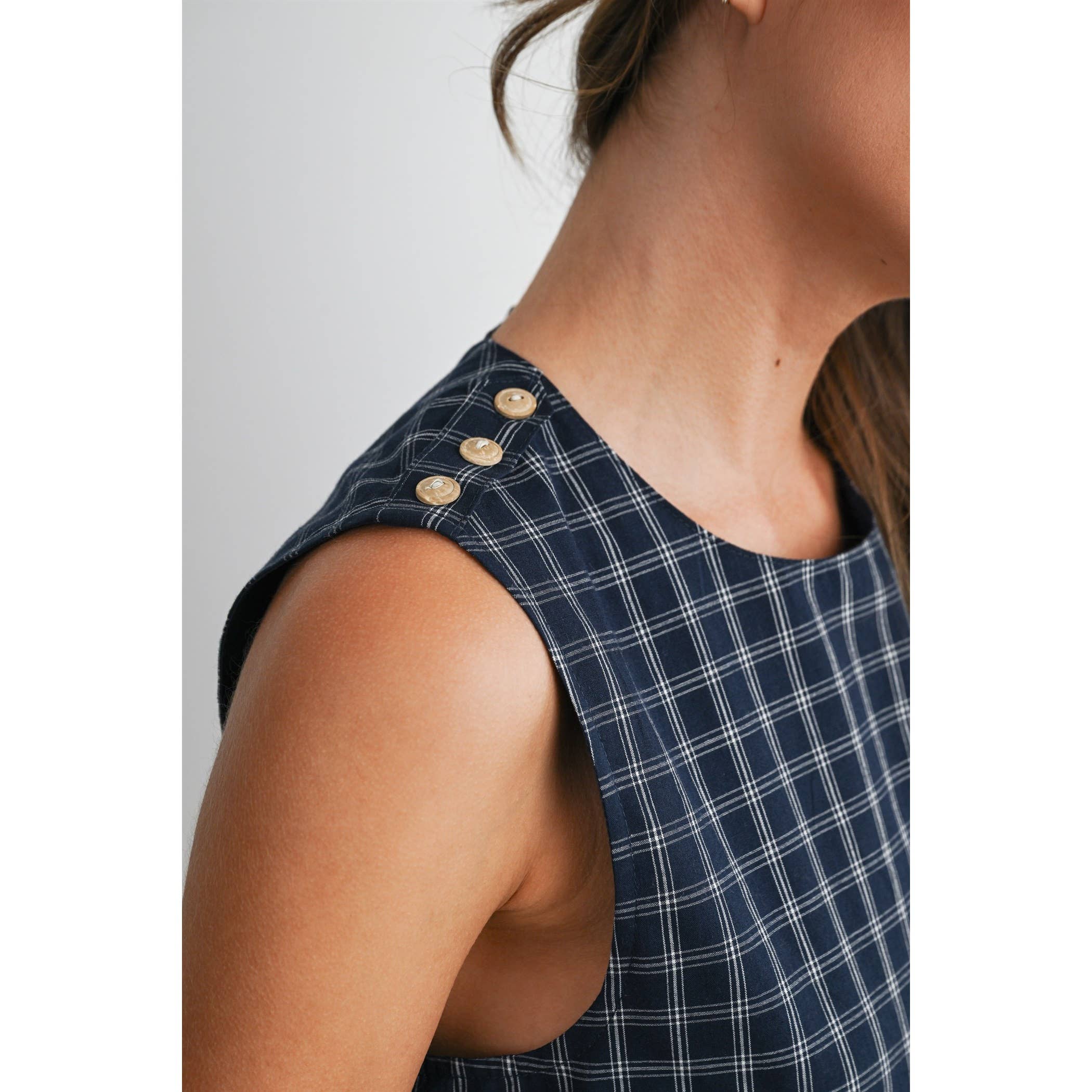 plaid mini dress, navy plaid dress, sleeveless plaid dress, button back dress, flounce hem dress, preppy plaid dress, fall mini dress, classic plaid dress, women's boutique dress, fall fashion, west of may boutique