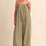 olive green jumpsuit, cotton wide leg jumpsuit, balloon hem jumpsuit, relaxed fit one piece outfit, casual summer jumpsuit, spaghetti strap jumpsuit, oversized cotton jumpsuit, boho green jumpsuit, jumpsuit with pockets, comfortable travel outfit