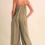 olive green jumpsuit, cotton wide leg jumpsuit, balloon hem jumpsuit, relaxed fit one piece outfit, casual summer jumpsuit, spaghetti strap jumpsuit, oversized cotton jumpsuit, boho green jumpsuit, jumpsuit with pockets, comfortable travel outfit