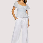 light blue peplum top women
square neck flutter sleeve top
feminine fitted summer blouse
romantic blue going out top
elevated casual boutique top
date night summer top women
european summer style clothing
light blue waist cinching blouse
west of may spritz collection