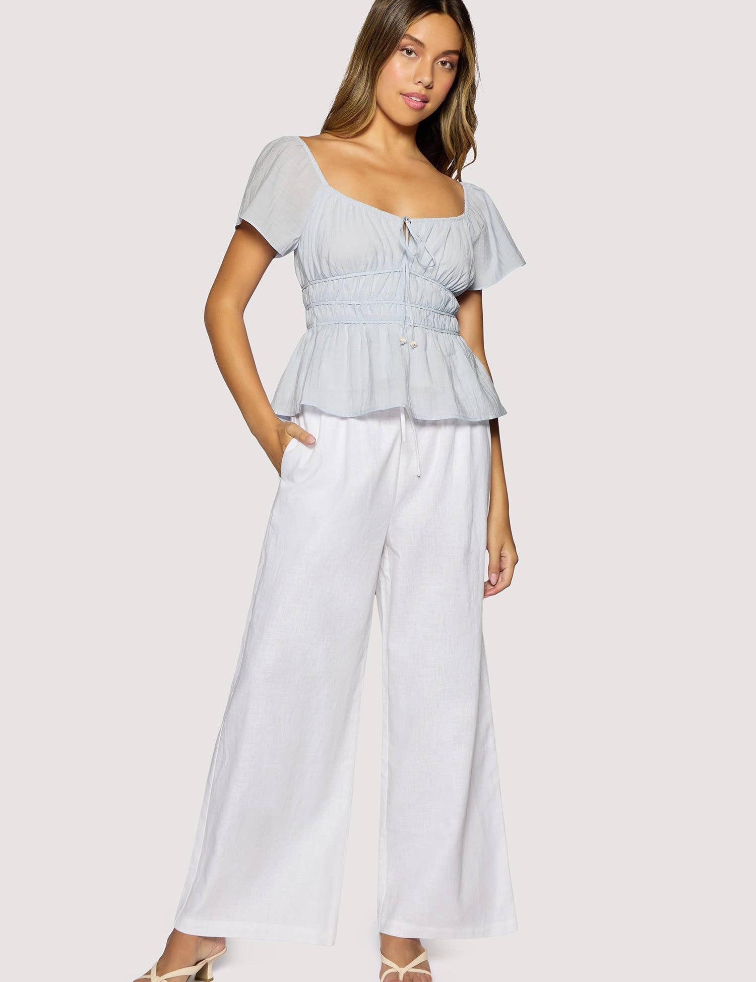 light blue peplum top women
square neck flutter sleeve top
feminine fitted summer blouse
romantic blue going out top
elevated casual boutique top
date night summer top women
european summer style clothing
light blue waist cinching blouse
west of may spritz collection