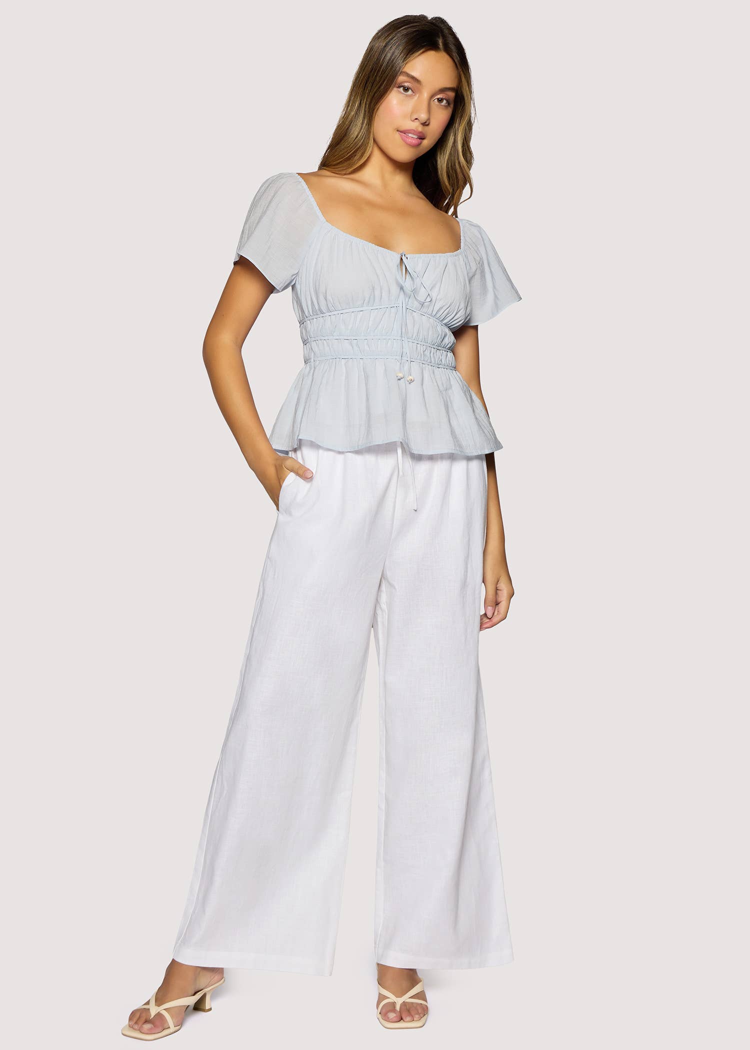 light blue peplum top women
square neck flutter sleeve top
feminine fitted summer blouse
romantic blue going out top
elevated casual boutique top
date night summer top women
european summer style clothing
light blue waist cinching blouse
west of may spritz collection