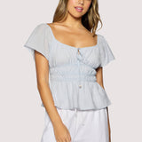 light blue peplum top women
square neck flutter sleeve top
feminine fitted summer blouse
romantic blue going out top
elevated casual boutique top
date night summer top women
european summer style clothing
light blue waist cinching blouse
west of may spritz collection
