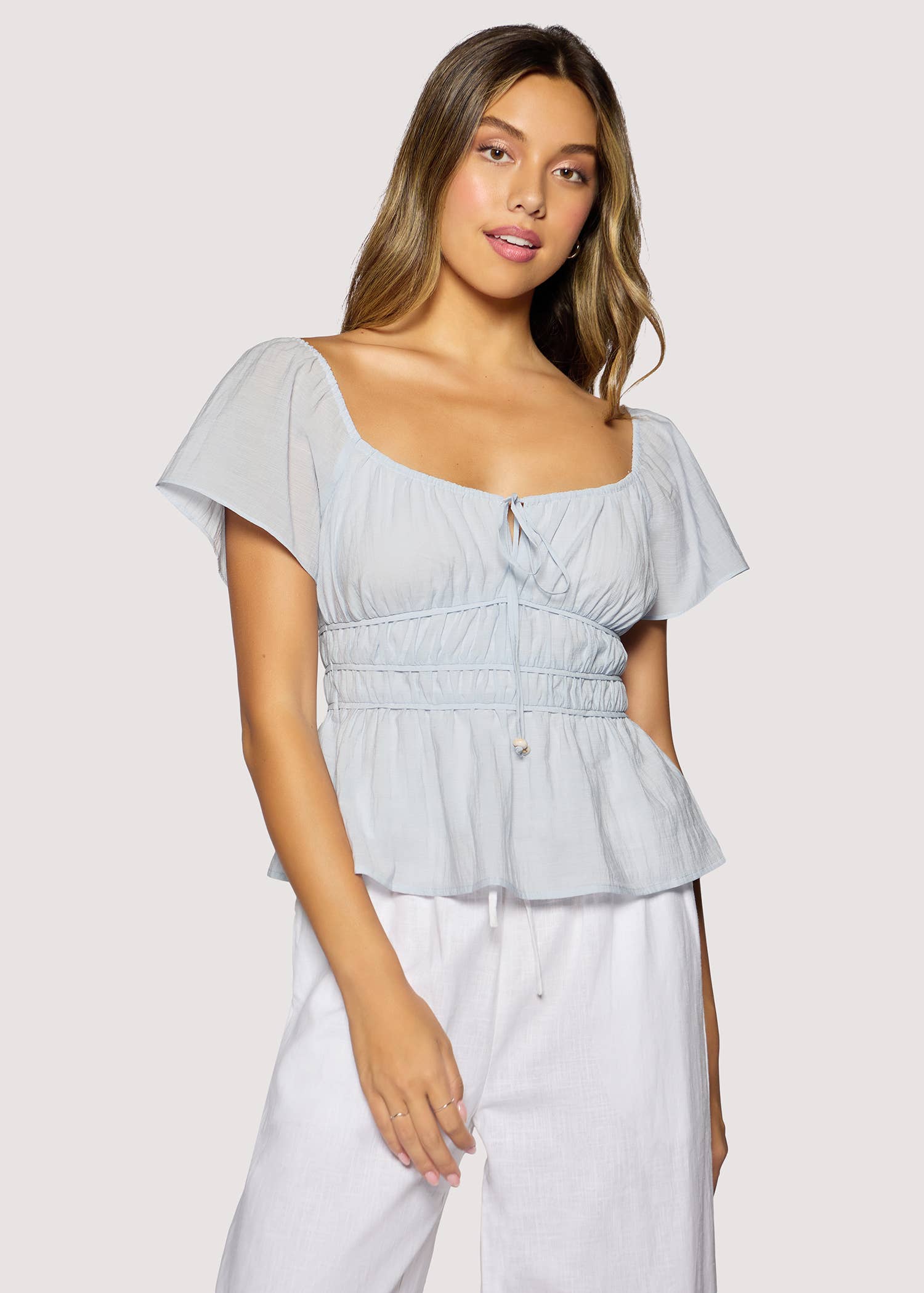 light blue peplum top women
square neck flutter sleeve top
feminine fitted summer blouse
romantic blue going out top
elevated casual boutique top
date night summer top women
european summer style clothing
light blue waist cinching blouse
west of may spritz collection