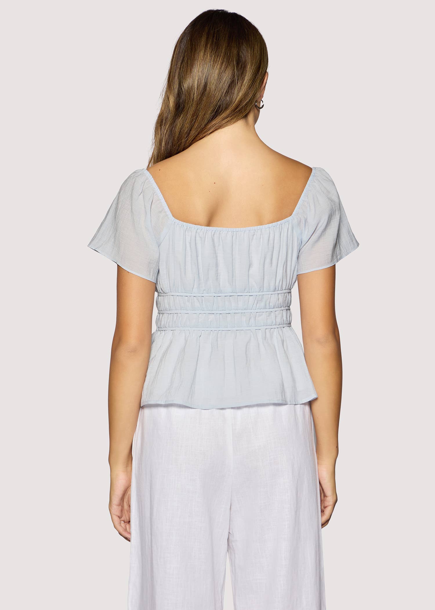 light blue peplum top women
square neck flutter sleeve top
feminine fitted summer blouse
romantic blue going out top
elevated casual boutique top
date night summer top women
european summer style clothing
light blue waist cinching blouse
west of may spritz collection