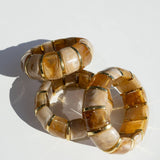 translucent caramel brown resin stretch bracelet with gold accents