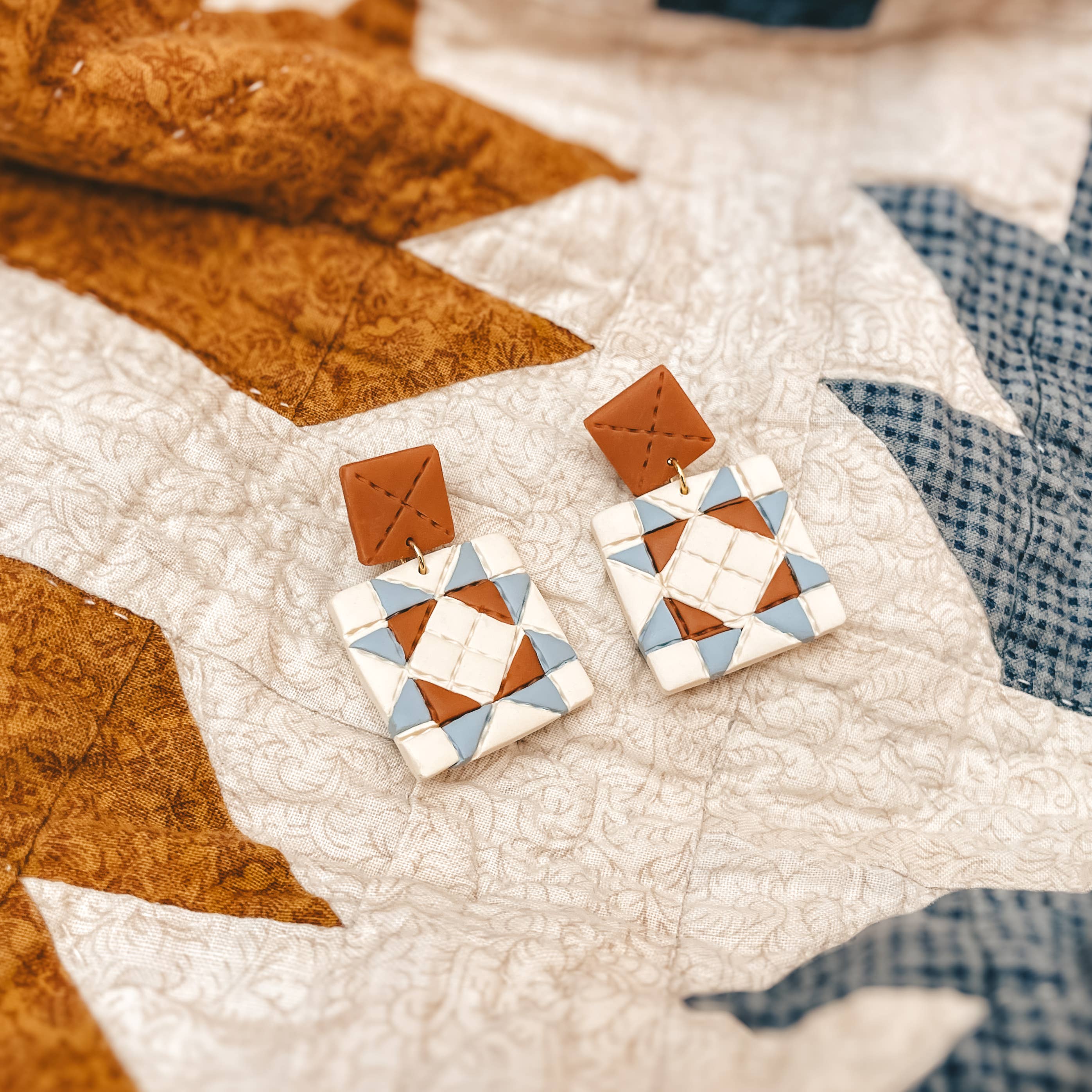 handmade quilt earrings, patchwork dangle earrings, polymer clay dangle earrings, quilt square earrings, colorful geometric earrings, artisan clay earrings, lightweight statement earrings, handcrafted polymer clay jewelry, handmade Michigan earrings, nickel free dangle earrings