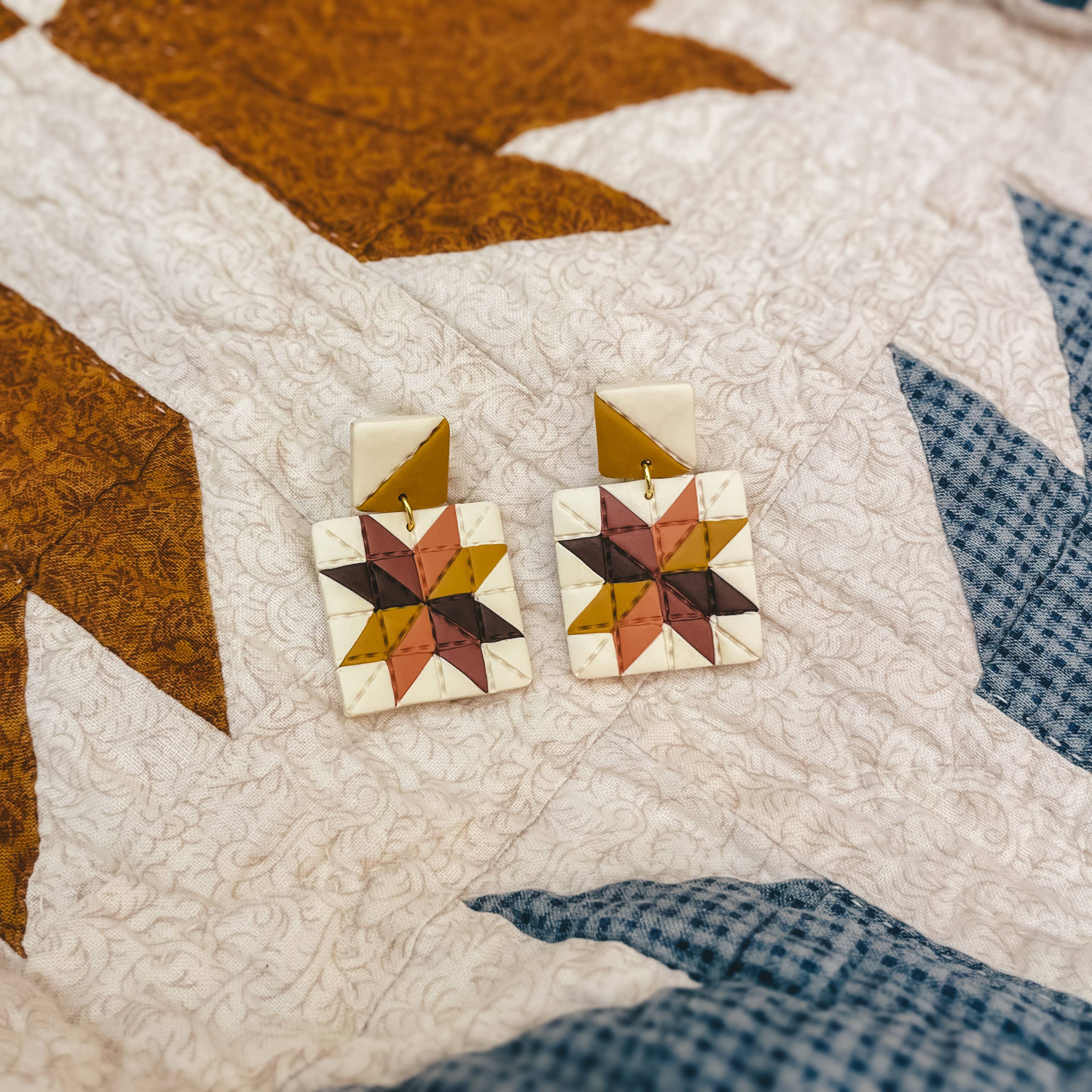 handmade quilt earrings, patchwork dangle earrings, polymer clay dangle earrings, quilt square earrings, colorful geometric earrings, artisan clay earrings, lightweight statement earrings, handcrafted polymer clay jewelry, handmade Michigan earrings, nickel free dangle earrings