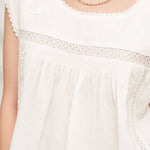 white embroidered blouse
embroidered summer top
white peasant blouse
lightweight rayon blouse
feminine summer top
casual white boutique top
embroidered detail shirt
relaxed fit white blouse
summer farmers market outfit
southern summer style
easy vacation outfit
white top with embroidery
flowy summer blouse
countryside summer fashion
casual feminine clothing
breathable warm weather top
white short sleeve blouse
classic summer wardrobe staple
boutique women's clothing
effortless everyday style