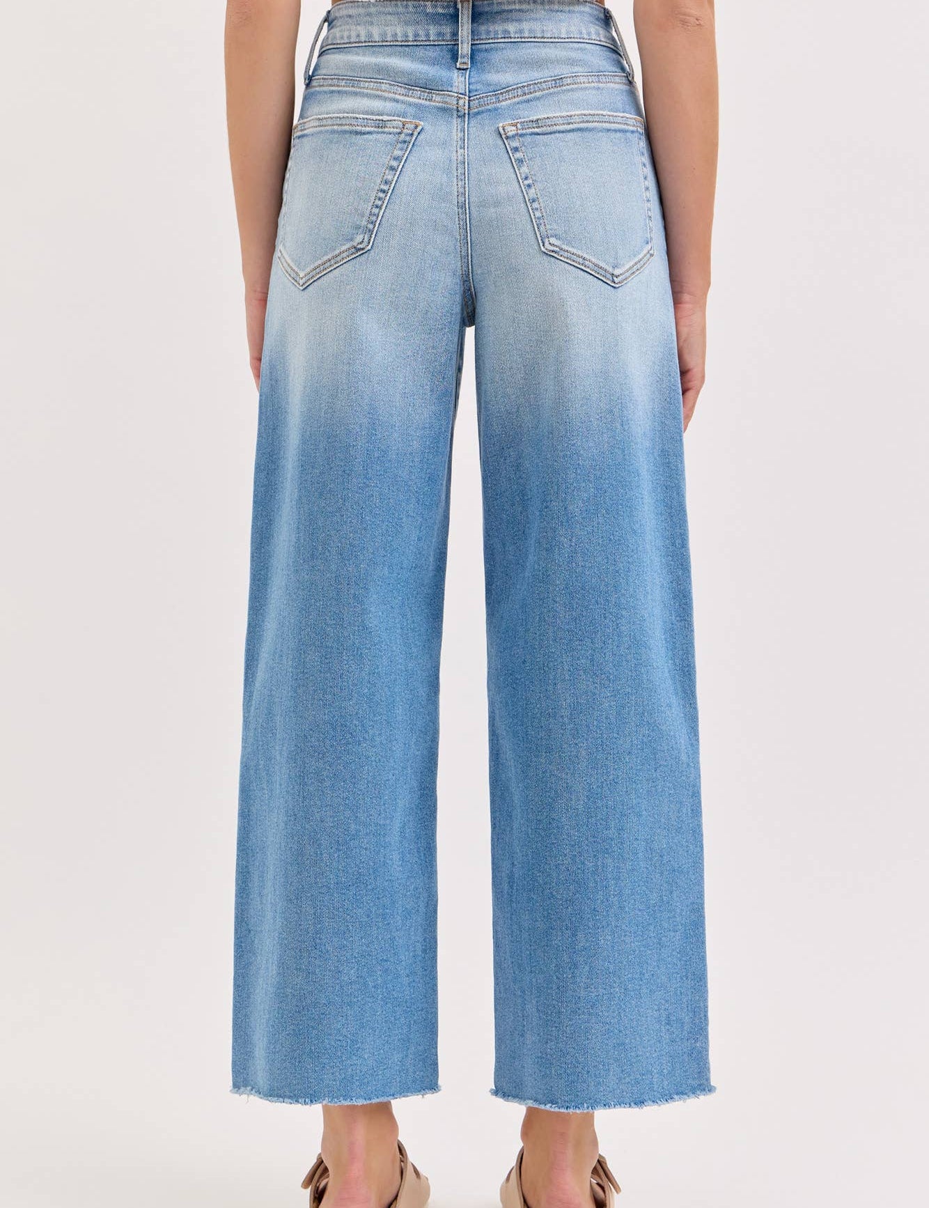 high rise wide leg jeans, light wash wide leg jeans, cropped wide leg denim, raw hem jeans, women's high rise jeans, light wash denim pants, stretchy wide leg jeans, everyday denim, cropped jeans women, casual blue jeans