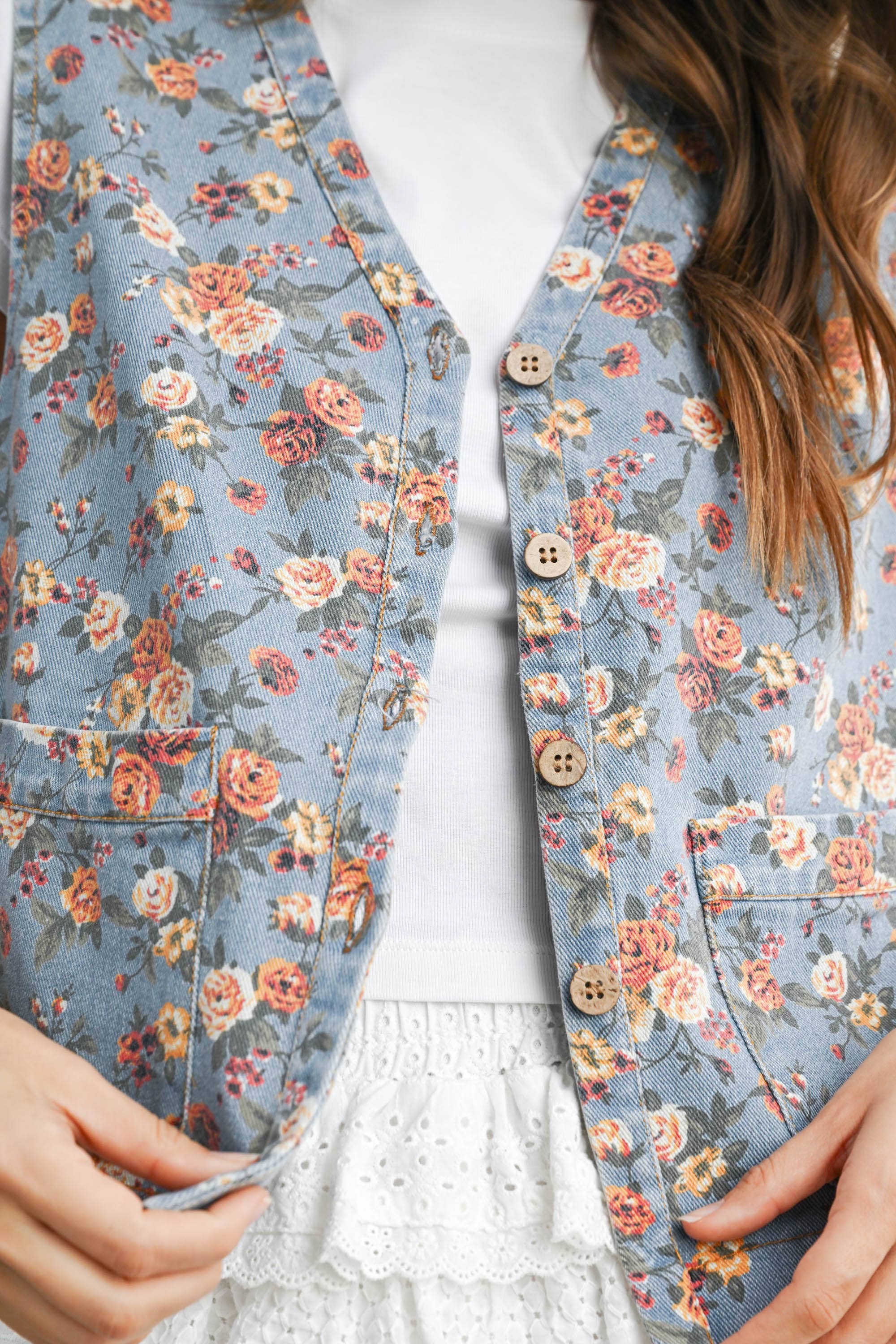 floral tie-front vest, cotton floral vest, women's floral vest, blue floral vest, tie-front vest, cottagecore vest, vintage inspired vest, layering vest, sleeveless floral top, fall layering piece, women's boutique vest, west of may boutique