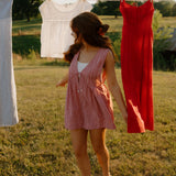 red gingham tie front romper
women's red gingham summer romper
sleeveless gingham romper with front ties
lightweight linen blend gingham romper
relaxed fit red check romper
americana inspired summer romper
red picnic gingham romper for women
casual sleeveless gingham playsuit
loose fit red gingham romper
vintage inspired gingham romper