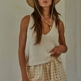 cream cotton sweater tank, v neck sweater tank, sleeveless cotton knit top, lightweight sweater tank, women's knit tank top, cream sleeveless sweater, relaxed fit sweater tank, cotton knit vest, neutral layering top, everyday sweater tank, side slit sweater tank, soft knit sleeveless top