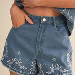 embroidered denim shorts
chambray embroidered shorts
high rise denim shorts
floral embroidered shorts
blue embroidered shorts
matching denim set
embroidered summer shorts
americana summer outfit
boutique denim shorts
lightweight chambray shorts
county fair outfit
southern summer style
women's embroidered shorts
casual summer bottoms
denim festival outfit