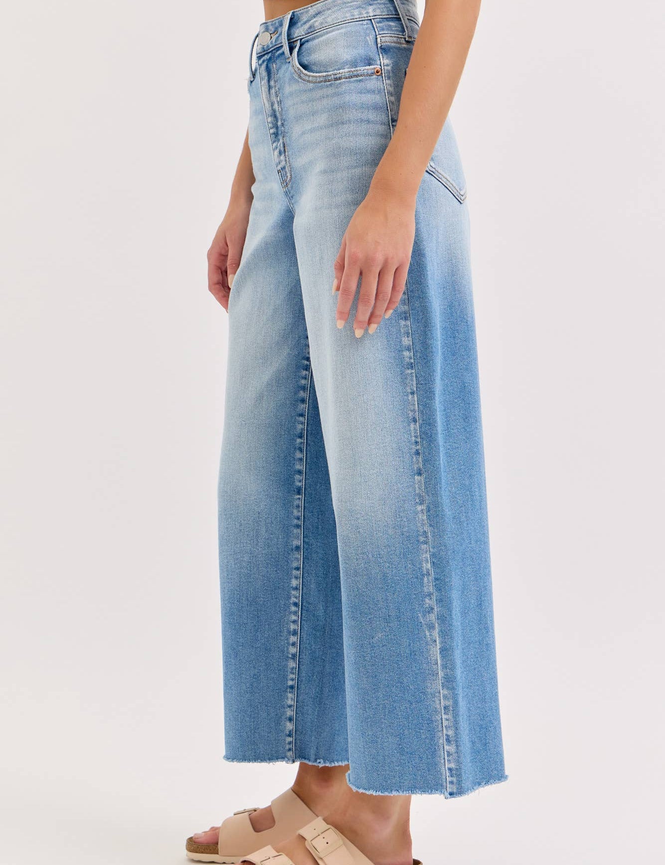 high rise wide leg jeans, light wash wide leg jeans, cropped wide leg denim, raw hem jeans, women's high rise jeans, light wash denim pants, stretchy wide leg jeans, everyday denim, cropped jeans women, casual blue jeans