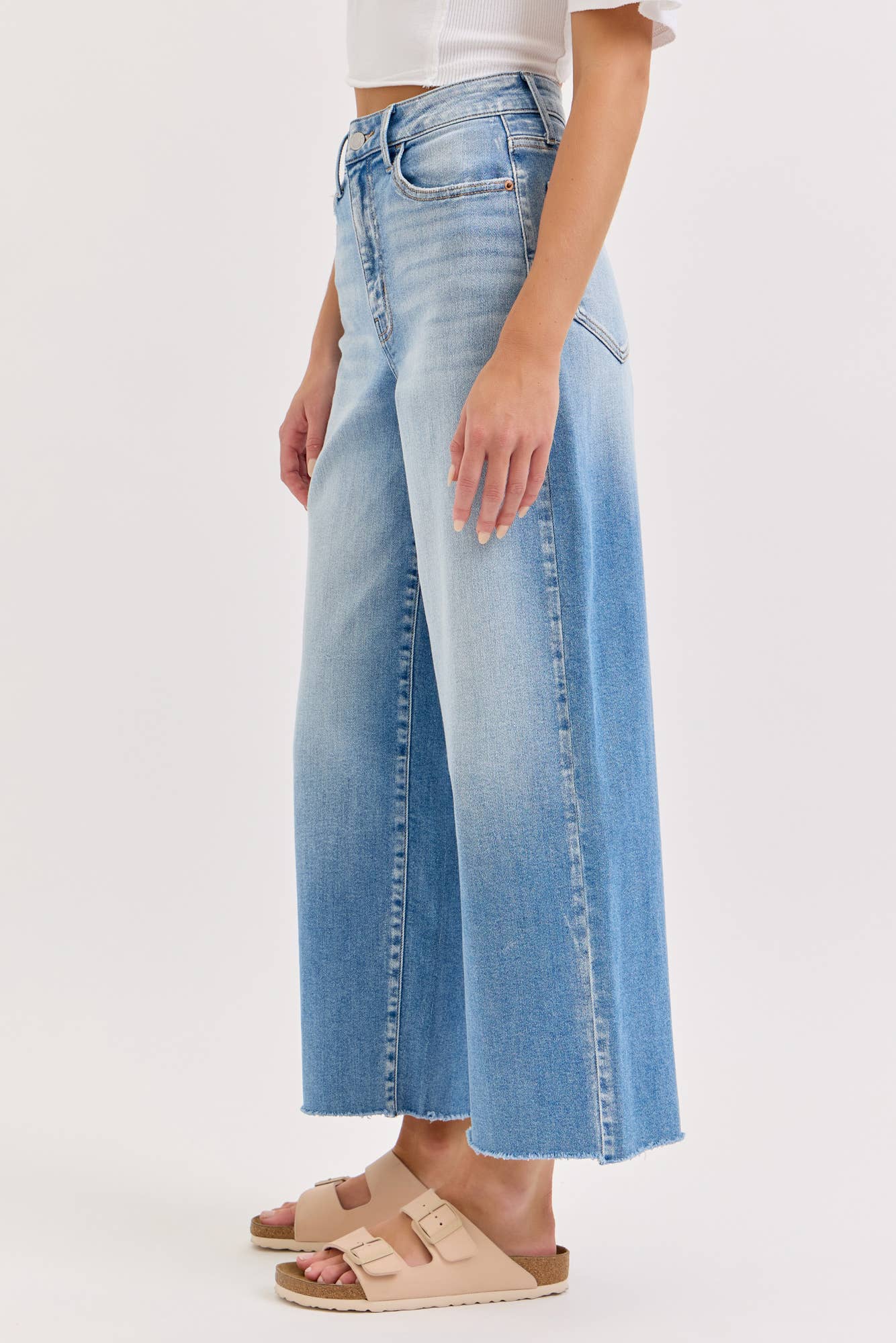 high rise wide leg jeans, light wash wide leg jeans, cropped wide leg denim, raw hem jeans, women's high rise jeans, light wash denim pants, stretchy wide leg jeans, everyday denim, cropped jeans women, casual blue jeans