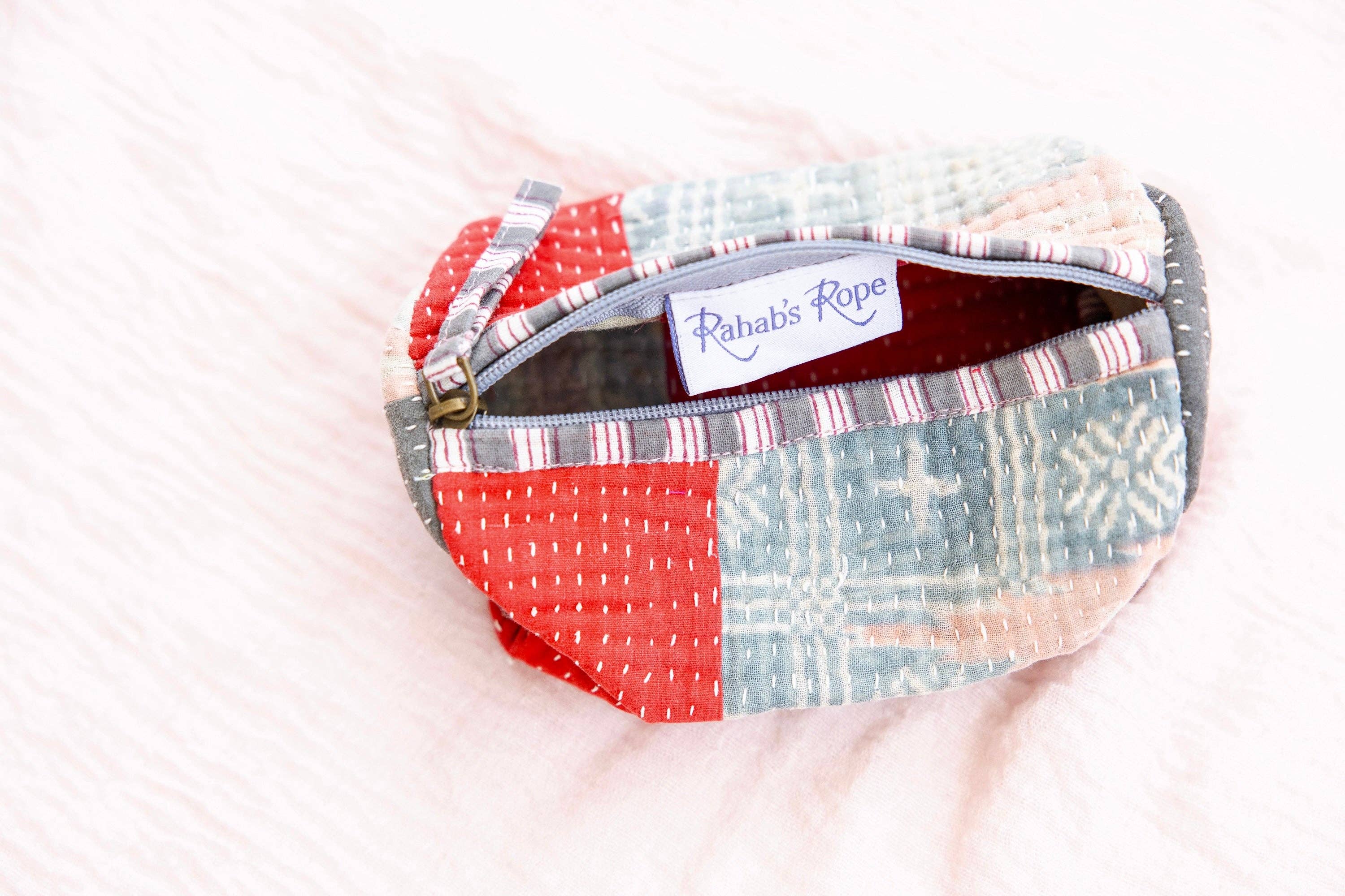 kantha pouch
patchwork cosmetic bag
handmade zipper pouch
artisan cosmetic pouch
kantha stitch pouch
upcycled textile pouch
handmade travel pouch
vintage fabric cosmetic bag
fair trade pouch
artisan made accessory
kantha makeup bag
one of a kind pouch
handcrafted zipper bag
sustainable gift idea
boho cosmetic pouch
handmade organizer pouch
ethical artisan gift
travel organizer pouch
vintage kantha textile
small zip pouch
unique gift ideas